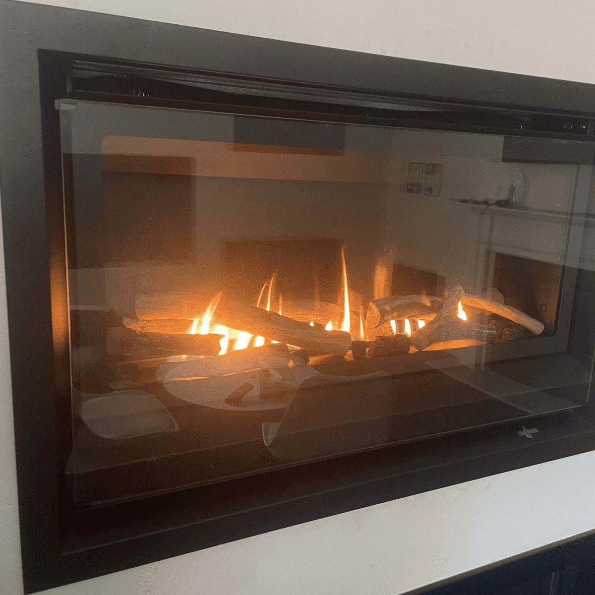 Fireplace Cleaning - An active fireplace in a showroom