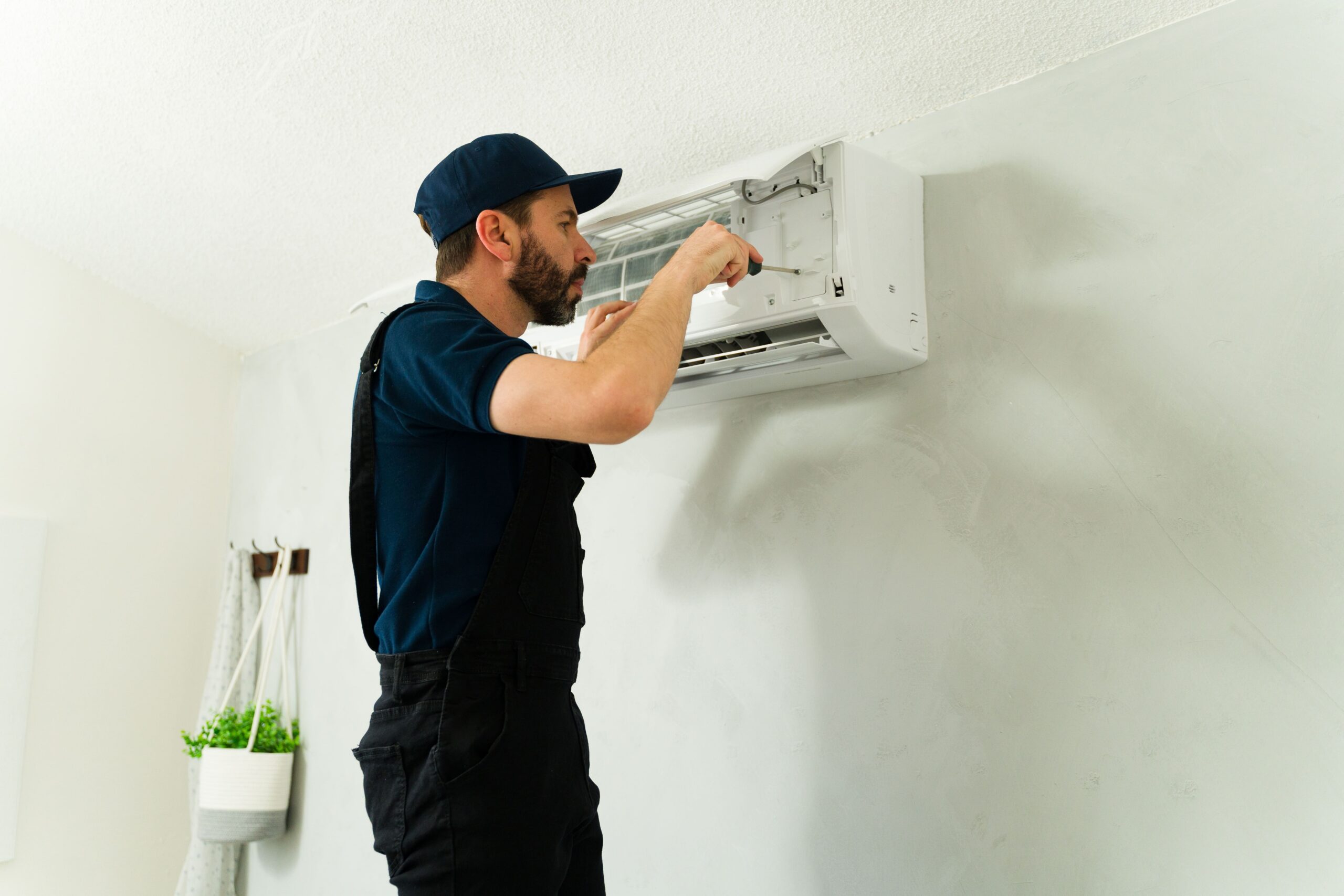 technician fixing split system