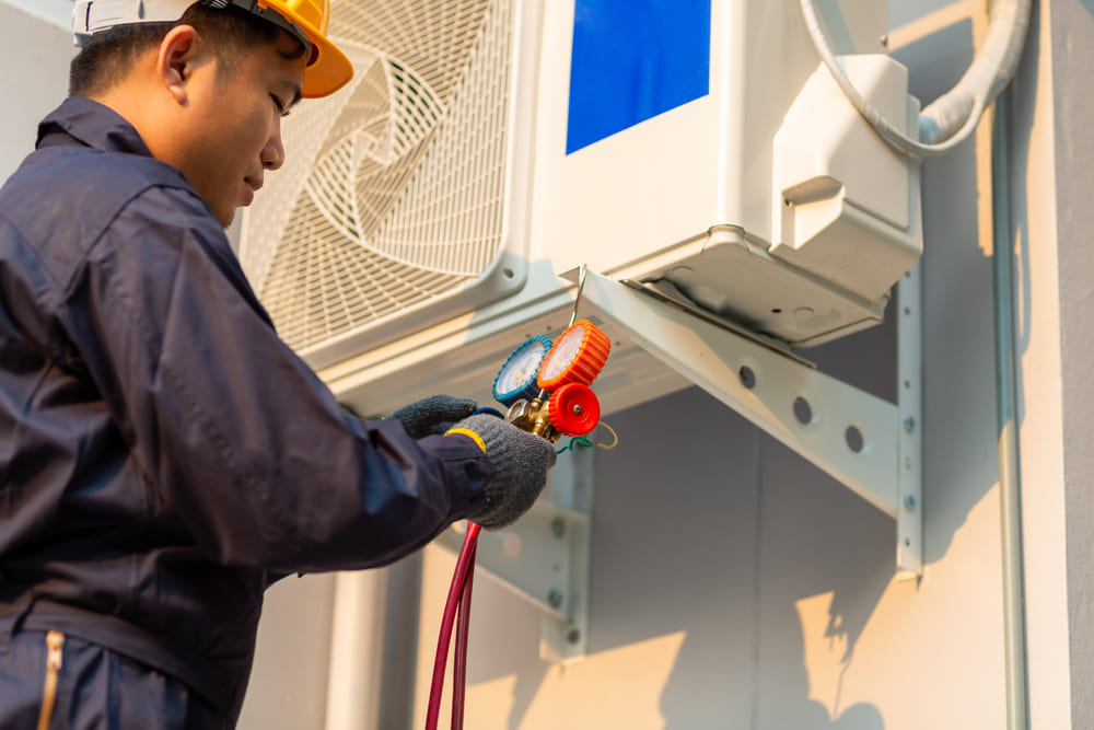 technician measuring split system measure