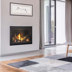 Modern gas log fires for homes with a Heat & Glo 5X fireplace installed in a cozy living room beside a white couch