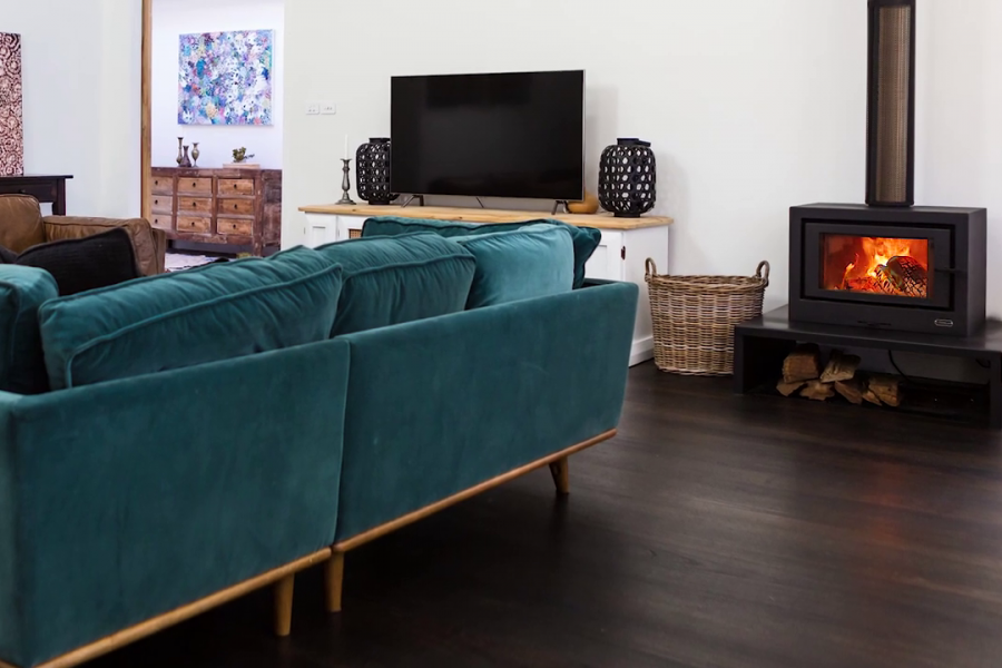 Cosy living room with a Kemlan Wood Fireplace providing warmth and comfort in a welcoming atmosphere