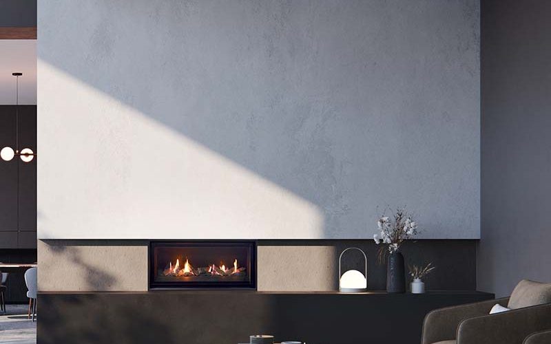 A modern living room with a Real Flame Element 900 gas fireplace and a stylish sofa